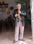 Vietnamese Man smoking Traditional Chinese Pipe