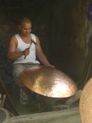 Moroccan Man Shaping Copper Cooking Pot
