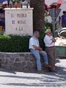 Two Spaniards having a "chin wag" in the shade!, Mijas