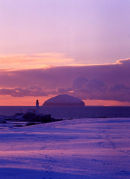 Winter sunset over Arran with Turnbery Lighthouse in foreground. This image has featured in the Scotsman Calender and several christmas cards