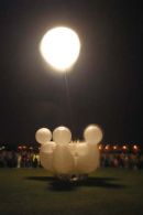 A strange set of inflated dancing fiqures parade as part of the Burns n a that festival
