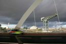 The new road bridge over the River Clyde as a taxi speeds by