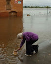 Old Lady desperate for water to flush the toilet during floods
