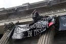 Protester waves defiantly at police helicopter 