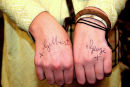 Gilbert & George’s signatures on a ladies hand arguable making the lady a living sculpture 