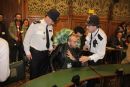 A heckler disturbs a Parliamentary meeting